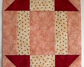 Stretched Churn Dash Quilt block