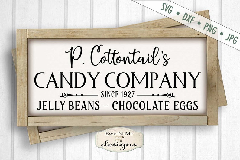 Puede incluir: Un letrero de madera con el texto "P. Cottontail's CANDY COMPANY SINCE 1927 JELLY BEANS - CHOCOLATE EGGS" en letras negras sobre fondo blanco.
