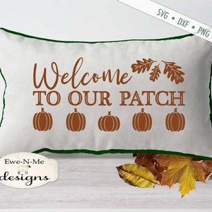 May include: A rectangular white pillow with a green border. The pillow features the text "Welcome TO OUR PATCH" in brown, along with five pumpkin illustrations. The top right corner has the text "SVG • DXF • PNG • JPG".