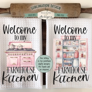 May include: Two white kitchen towels with a pink farmhouse kitchen design. One towel features a pink stove with the text "Welcome to my Farmhouse Kitchen". The other towel features a pink refrigerator with the text "Welcome to my Farmhouse Kitchen".