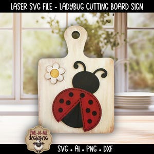 May include: A wooden cutting board with a ladybug design. The ladybug is red with black spots and a black head. A white daisy is on the left side. The text "LASER SVG FILE - LADYBUG CUTTING BOARD SIGN" is at the top.