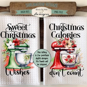 May include: Two white waffle-weave kitchen towels with Christmas-themed designs. One features a green mixer with "Sweet Christmas Wishes," and the other a red mixer with "Christmas Calories don't count." A rolling pin and cutting board are in the background.