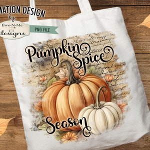 May include: White tote bag with a fall-themed design. The design features two pumpkins, one orange and one white, with the words "Pumpkin Spice Season" in elegant script. The background includes autumn leaves and script.