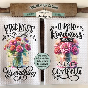 May include: Two white kitchen towels with a floral design and text. The first towel says "Kindness changes everything" and the second towel says "Throw kindness around like confetti".
