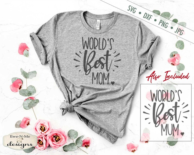 May include: A grey t-shirt with the text "WORLD'S Best MOM" in black lettering. The shirt is displayed on a white surface with pink flowers and green leaves.
