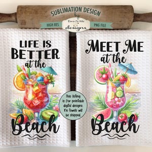 May include: Two white kitchen towels with colorful illustrations of tropical drinks and fruit. The text on the towels reads "Life is better at the beach" and "Meet me at the beach".