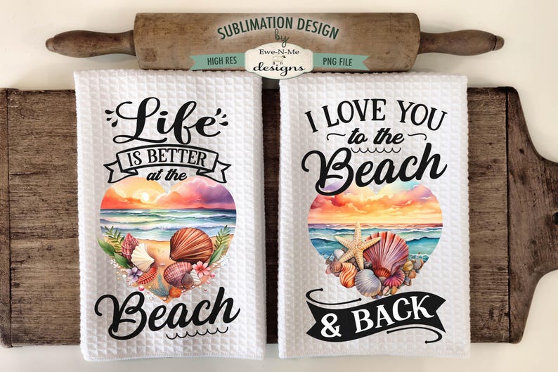 May include: Two white kitchen towels with a beach theme. The first towel says "Life is better at the beach" with a watercolor sunset and seashells. The second towel says "I love you to the beach & back" with a watercolor sunset and seashells.