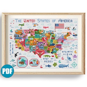 May include: A framed cross-stitch map of the United States of America, featuring each state in a different color. The map includes the text "The United States of America" and is surrounded by a wooden frame. The PDF logo is in the bottom left corner.