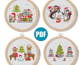 Peut inclure: Quatre cerceaux de broderie au point de croix avec des motifs de Noël. Les motifs incluent des hérissons, des pingouins, des cerfs et des ours, tous vêtus de tenues de fête. Chaque cerceau est dans un cadre en bois, idéal pour les décorations de saison.
