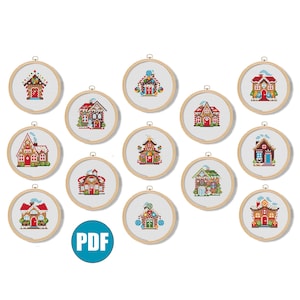 May include: Twelve different cross-stitch patterns of gingerbread houses, each with a unique design and color scheme. The patterns are displayed in circular wooden embroidery hoops.
