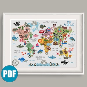 Puede incluir: Un patrón de punto de cruz titulado MY WORLD que presenta un mapa mundial colorido con ilustraciones pixeladas de animales, monumentos y océanos. El diseño incluye los continentes etiquetados como North America, South America, Europe, Africa, Asia, Australia y Antarctica.