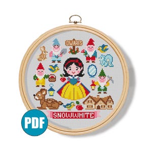 May include: A cross-stitch embroidery hoop with a Snow White design. The design includes Snow White, the seven dwarfs, and other elements from the fairy tale. The word "SNOWWHITE" is displayed on a banner. A PDF icon is in the lower left corner.