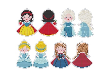 Peut inclure: Collection de huit poupées princesses en point de croix. Les poupées représentent différents personnages de princesses dans leurs tenues emblématiques, dont Blanche-Neige, Elsa et Cendrillon. Chaque poupée a une boucle pour être suspendue.