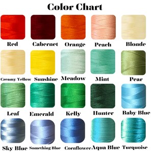 May include: Color chart showing 18 different embroidery floss colors, including red, orange, peach, yellow, green, blue, and turquoise.