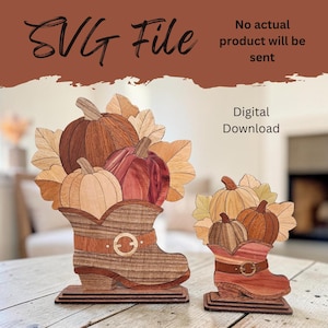 May include: A digital download SVG file featuring two wooden-style boot decorations filled with pumpkins and leaves. The text reads SVG File, No actual product will be sent, and Digital Download. The design uses brown, tan, and red tones.