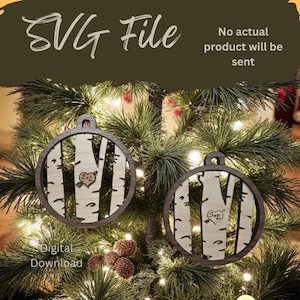 May include: Two wooden Christmas ornaments with a birch tree design, each with a circular frame and a small loop for hanging. The ornaments are displayed on a Christmas tree. The text "SVG File" and "Digital Download" are visible.