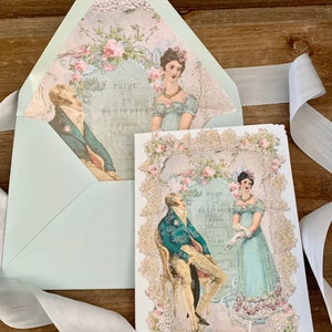 May include: A light blue envelope and card set featuring illustrations from "Pride and Prejudice." The card and envelope interior display images of a man and woman in period attire, surrounded by floral and lace embellishments. The text "Pride and Prejudice" is visible.