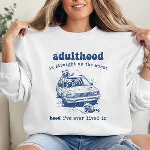 Adulthood Is Straight Up The Worst Hood I&#39;ve Lived In Funny Sweatshirt, Sarcastic Snarky, Funny Raccoon Sweatshirt, Funny Sarcastic Quote