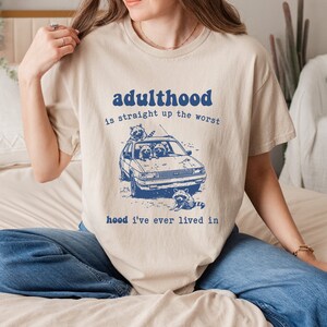 Adulthood Is Straight Up The Worst Hood I&#39;ve Lived In T-Shirt, Sarcastic Snarky Shirt, Funny Raccoon Tee, Adult Humor, Sarcastic Quote