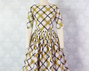 Robe à carreaux dorée et noire Abact années 50