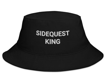 May include: Black bucket hat with white embroidered text that reads "SIDEQUEST KING"