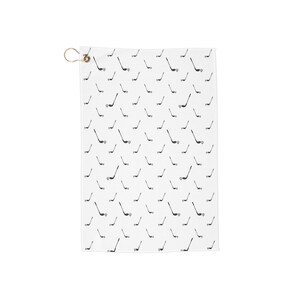 May include: White golf towel with a repeating pattern of black golf clubs and golf balls. The towel has a brass grommet for hanging. A golf-themed accessory.