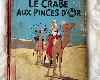 Les Aventures de Tintin : Le crabe aux pinces d'or d'Hergé, première édition de la bande dessinée à couverture rigide en français, publiée en 1943 par Casterman