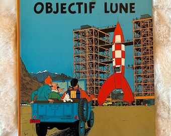 Les Aventures de Tintin : Objectif Lune d'Hergé, première édition de la bande dessinée à couverture rigide en français, publiée en 1953 par Casterman