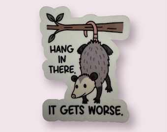 Hang in there, it gets worse. Funny sticker to tease your mental health and make light of a situation.