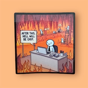 May include: Square magnet featuring a humorous illustration of a stick figure working at a desk in hell. The scene includes flames, other stick figures, and a sign that reads "AFTER THIS, HELL WILL BE EASY."