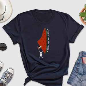 May include: A navy blue t-shirt with a graphic of a watermelon slice shaped like Israel with a flag on top. The text "A slice of resilience" is written vertically on the side of the watermelon.