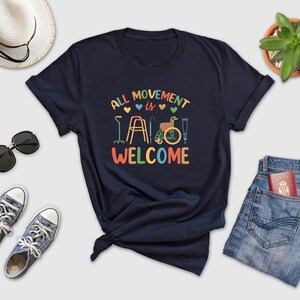 a t - shirt that says, all movement is welcome