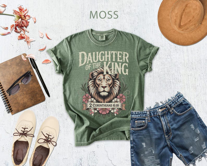 a variety of items, including a green t-shirt with a lion design, a hat, sunglasses, a notebook, a pair of shoes, and denim shorts, all arranged on a white background.