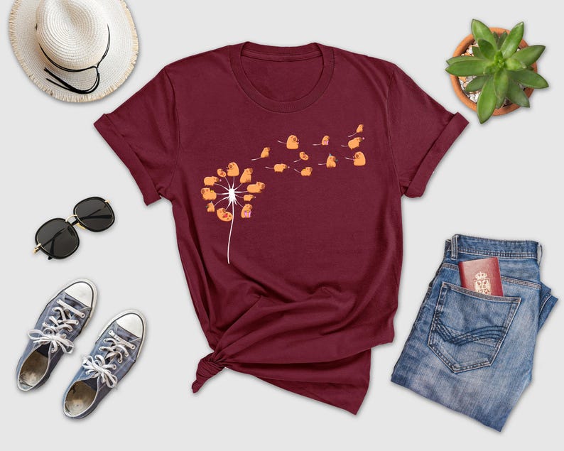a t - shirt with a dandelion design on it