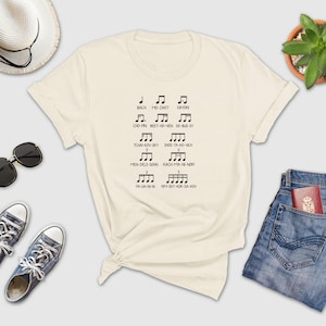 a t - shirt that has musical notes on it