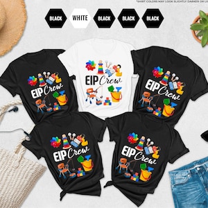 May include: A white ceramic mug with a black handle and the text "But First, Coffee" in a black, handwritten-style font. The mug is on a white surface.