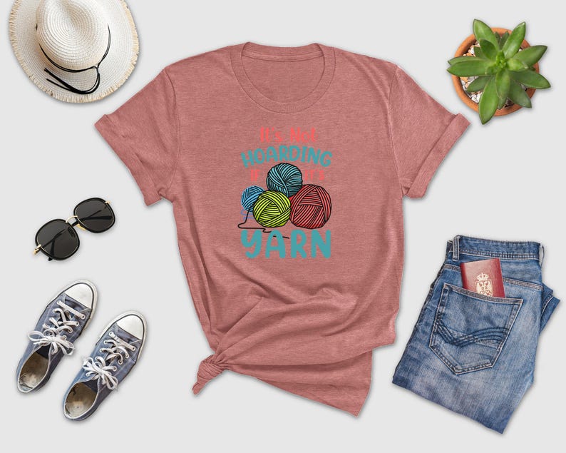 a women's t - shirt that says knitting is fun