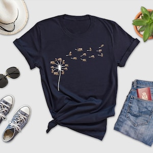 a t - shirt that has a dandelion on it