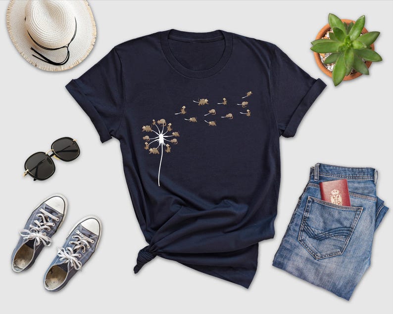 a t - shirt that has a dandelion on it