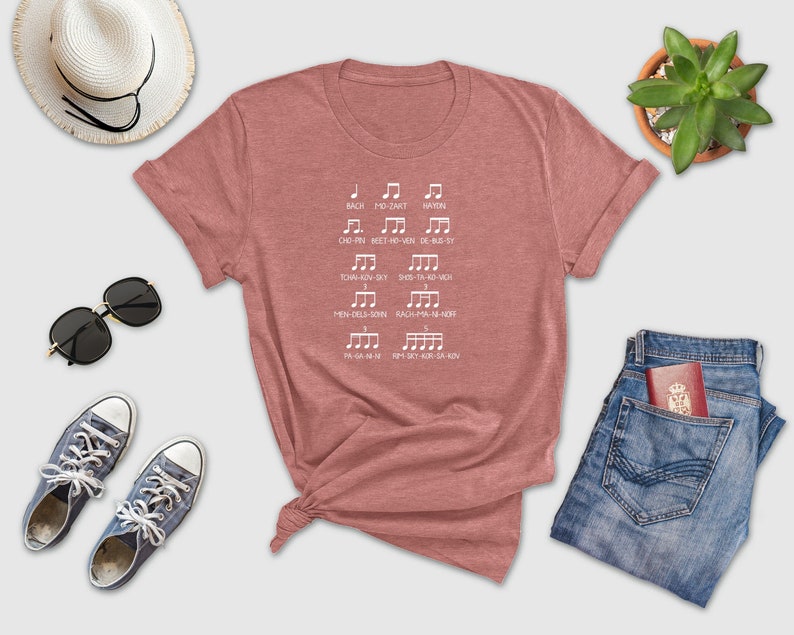 a women's t - shirt with musical notes on it