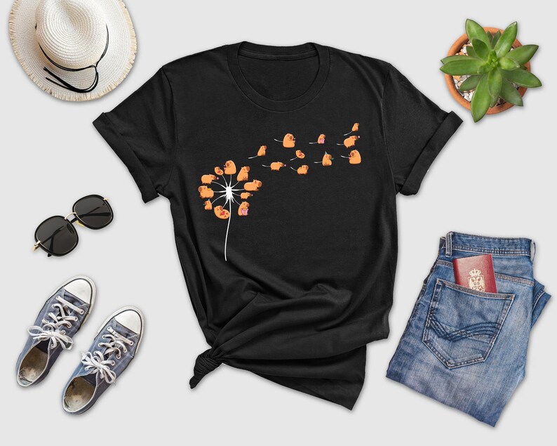 a t - shirt with a dandelion design on it