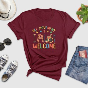 a t - shirt that says, all movement is welcome
