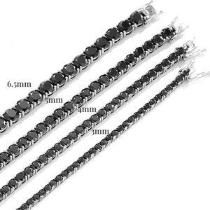 May include: Four black tennis chain necklaces of different sizes, 3mm, 4mm, 5mm, and 6.5mm. The chains are made of silver and have a polished finish.