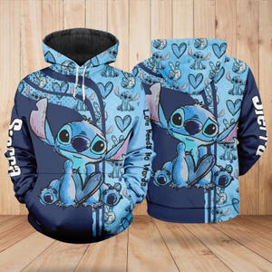 May include: A blue hoodie featuring a cartoon character with large ears and big eyes. The hoodie has a black hood and is decorated with hearts, peace signs, and the words "Love Needs No Words". The sleeves have the word "Stitch" printed on them.