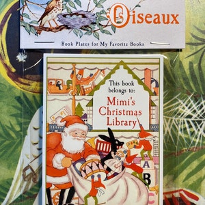 A bookplate featuring a charming vintage illustration of Santa and elves in his workshop. Toys fill the shelves behind them, 2 elves push toys into the sack, 1 stands on blocks and paints the name on a white dollhouse. Name is red, text black