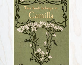 May include: A vintage-style bookplate with the text "This book belongs to: Camilla" in gold lettering. The design features a green background with a floral border and white flowers. The overall aesthetic is reminiscent of antique botanical illustrations.