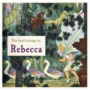 May include: A vintage book cover illustration featuring a girl in a white dress and cape walking through a forest with a stick. She is followed by a line of white geese with purple and pink feathers. The text "This book belongs to: Rebecca" is printed on the cover.