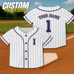 May include: White baseball jersey with navy blue pinstripes, a navy blue number 1, and the text "YOUR NAME" on the back. The jersey has a button-up front and the text "CUSTOM ANY REQUEST" in the upper left corner.
