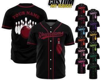 May include: Black bowling jersey with red accents, featuring a bowling pin graphic on the pocket and a bowling ball and pins design on the back. The text "Your Name" is on the back. Additional jerseys in various colors are displayed.