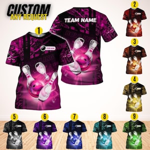 May include: A collection of bowling-themed t-shirts. The primary shirt is a vibrant magenta with a bowling pin and ball design. The text "CUSTOM ANY REQUEST" and "BOWLING" are visible. Additional shirts in various colors are displayed.